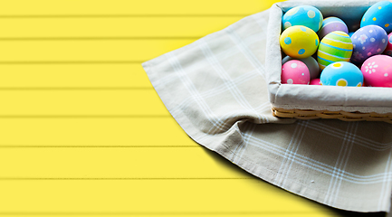 Image showing close up of colored easter eggs in basket