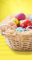 Image showing close up of colored easter eggs in basket