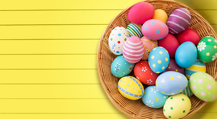 Image showing close up of colored easter eggs in basket