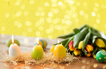 Image showing candles in shape of easter eggs and tulip flowers