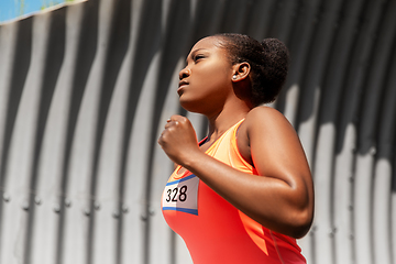Image showing young african american woman running marathon