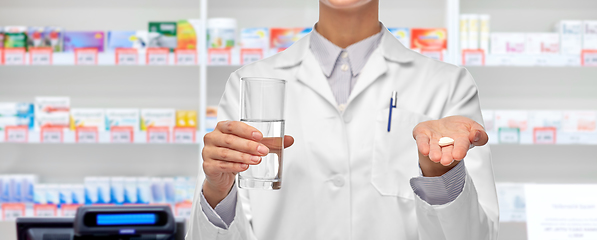 Image showing female doctor with medicine and water pharmacy