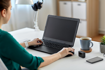 Image showing woman with laptop working at home office