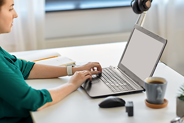 Image showing woman with laptop working at home office