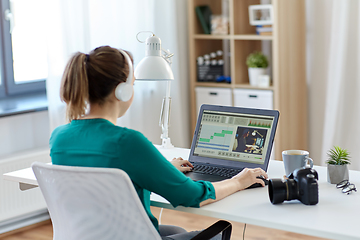 Image showing woman with video editor program on laptop at home