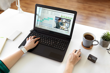 Image showing woman with video editor program on laptop at home