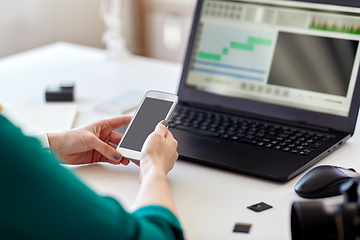 Image showing woman smartphone and laptop working at home