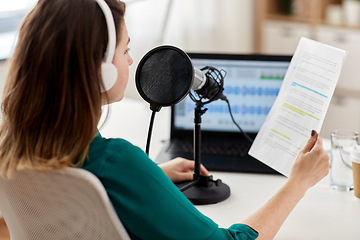 Image showing woman with microphone recording podcast at studio