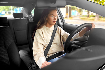 Image showing woman or female driver driving car in city