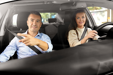 Image showing car driving school instructor teaching woman