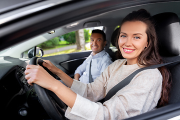 Image showing car driving school instructor teaching woman