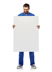 Image showing smiling male doctor or nurse with big white board