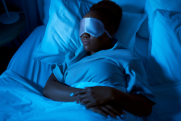 Image showing african woman sleeping in bed at home at night