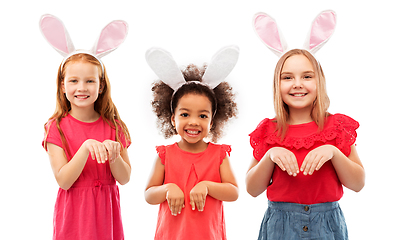 Image showing happy girls wearing easter bunny ears headbands