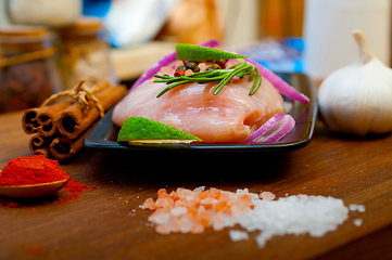 Image showing fresh organic chicken breast with herbs and spices