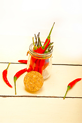 Image showing red chili peppers on a glass jar