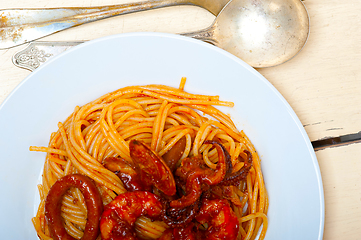 Image showing Italian seafood spaghetti pasta on red tomato sauce