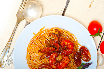 Image showing Italian seafood spaghetti pasta on red tomato sauce