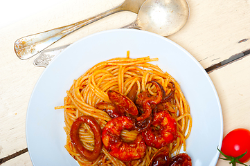 Image showing Italian seafood spaghetti pasta on red tomato sauce