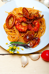 Image showing Italian seafood spaghetti pasta on red tomato sauce