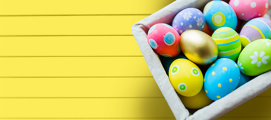 Image showing close up of colored easter eggs in basket