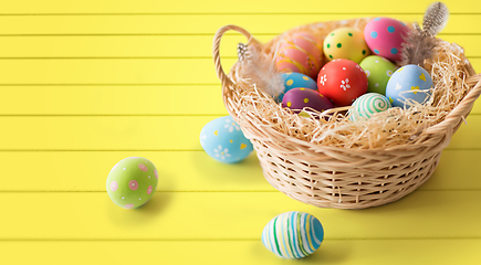 Image showing close up of colored easter eggs in basket