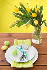 Image showing easter egg, plates, cutlery and tulip flowers