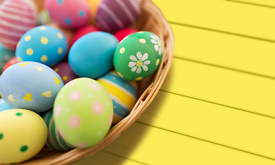 Image showing close up of colored easter eggs in basket