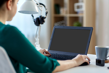 Image showing woman with laptop working at home office