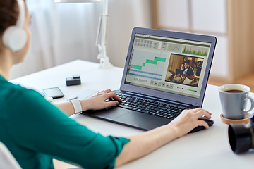 Image showing woman with video editor program on laptop at home