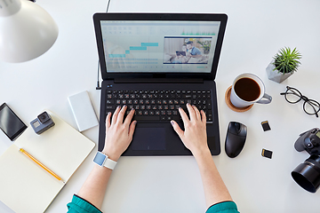 Image showing woman with video editor program on laptop at home