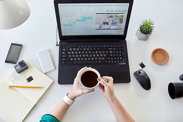 Image showing woman with video editor program on laptop at home