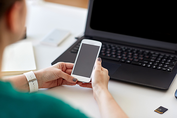 Image showing woman smartphone and laptop working at home