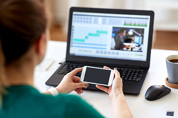 Image showing woman smartphone and laptop working at home