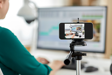 Image showing smartphone recording woman working in video editor