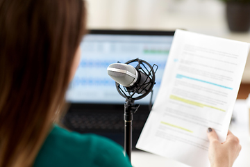 Image showing woman with microphone recording podcast at studio