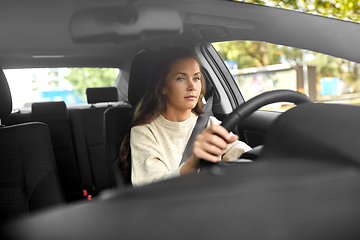 Image showing woman or female driver driving car in city