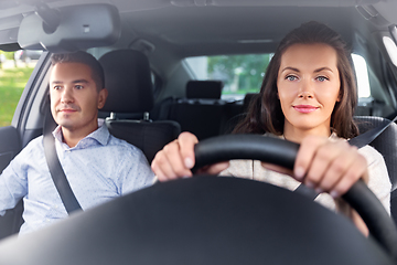 Image showing car driving school instructor teaching woman