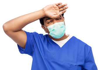 Image showing tired indian male doctor in blue uniform and mask