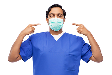 Image showing indian male doctor in blue uniform showing mask