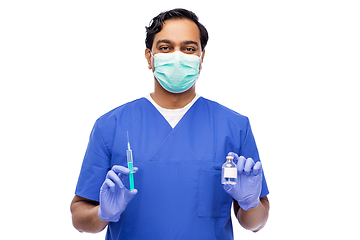 Image showing indian doctor in mask with syringe and medicine