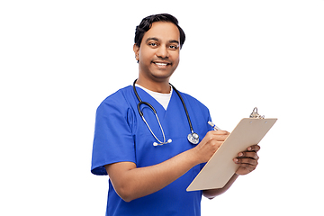 Image showing male doctor writing medical report on clipboard