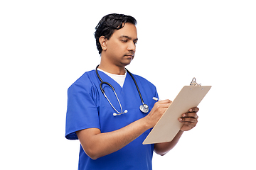 Image showing male doctor writing medical report on clipboard