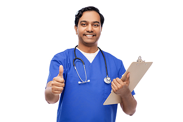 Image showing smiling doctor or male nurse showing thumbs up