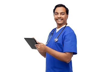 Image showing smiling doctor or male nurse using tablet computer