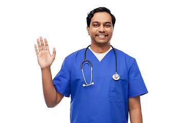 Image showing doctor or male nurse with stethoscope waving hand