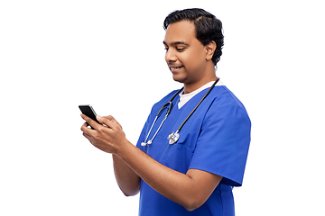 Image showing smiling doctor or male nurse using smartphone