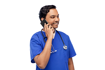 Image showing smiling doctor or male nurse calling on smartphone