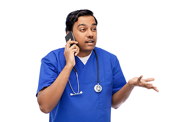 Image showing indian doctor or male nurse calling on smartphone