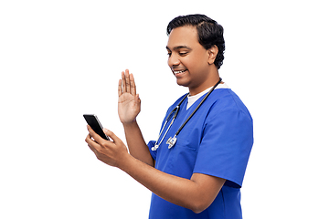 Image showing doctor or male nurse having video call on phone